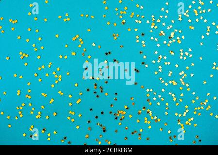 Light blue background with golden stars sparkles Stock Photo
