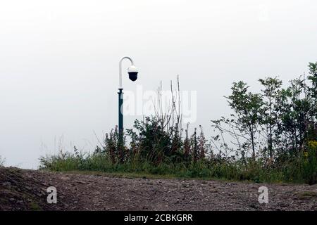 A security camera on pole in the countryside, with copy space. Stock Photo