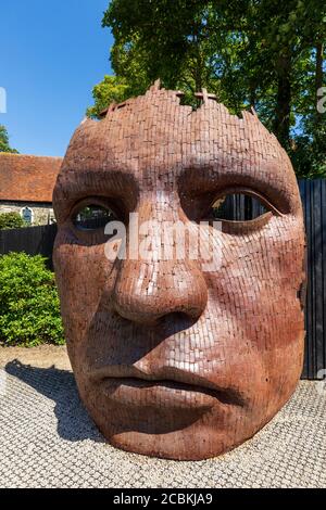 The Iron Face sculpture along the Great Stour outside the Marlowe Theatre, Canterbury, Kent, England Stock Photo