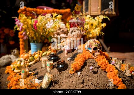 La Santa Muerte Altar with flowers, Lake Patzcuaro, Michoacan, Mexico Stock Photo