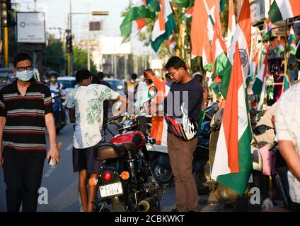 Guwahati, Assam, India. 14th Aug, 2020. Vendor selling tricolour on the street ahead of Independence day, amid coronavirus pandemic in Guwahati. Credit: David Talukdar/ZUMA Wire/Alamy Live News Stock Photo