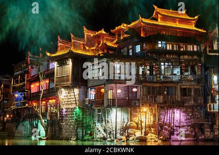 Traditional buildings at night, Fenghuang, Hunan, China Stock Photo