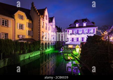 Floodlit canal and christmas lights at night, Little Venice, Colmar, France Stock Photo