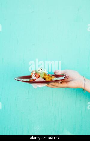 Hand holding plate of fresh fish taco, Ensenada, Baja California, Mexico Stock Photo