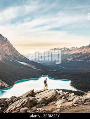 Man standing, looking at view, viewpoint overlooking Peyto Lake, Lake Louise, Alberta, Canada Stock Photo