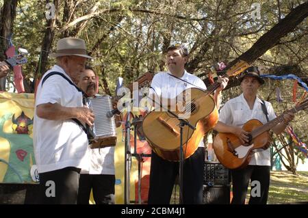 Austin, Texas USA, April, 2006: Traditional Mexican-style band plays for the crowd at a Barton Hills community festival in south Austin as a fund-raiser to support the arts education at the neighborhood elementary school.  ©Bob Daemmrich / Stock Photo