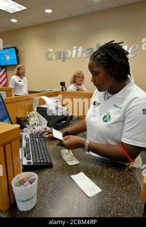 Georgetown, TX August 1, 2006: An African-American teller ...