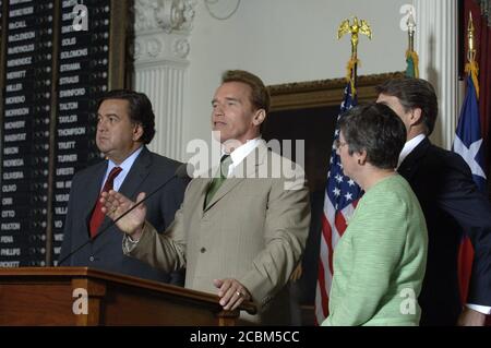 Austin, Texas August, 25, 2006: California Gov. Arnold Schwarzenegger speaks to the press as governors Bill Richardson (left) of New Mexico and Janet Napolitano of Arizona listen at the Border Governors Conference at the Texas Capitol. ©Bob Daemmrich Stock Photo