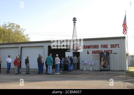 Crawford, Texas USA, November 7, 2006: Crawford residents line up at the fire station to vote about an hour after U.S. President George W. Bush voted at 7 AM in the U.S. mid-term elections. ©Bob Daemmrich Stock Photo