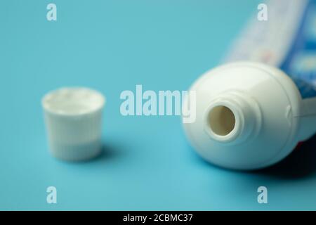 Toothpaste on blue background close-up with copy space Stock Photo