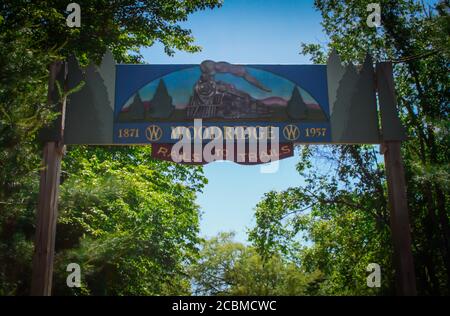 WOODRIDGE, NY, UNITED STATES - Jun 17, 2020: Woodridge, NY / USA - 06/16/2020: Woodridge Rails to Trails Carved Wooden Entrance Sign of Historic Train Stock Photo