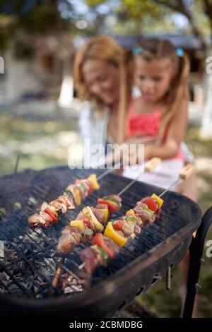 Barbecue, grilling.Family time together- barbecue grill with various kinds of juicy meat Stock Photo