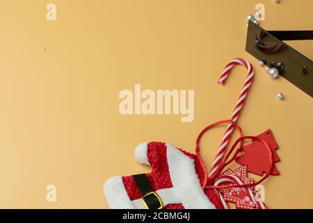 Christmas design flat lay on orange background top view, New Year theme objects with copy space Stock Photo