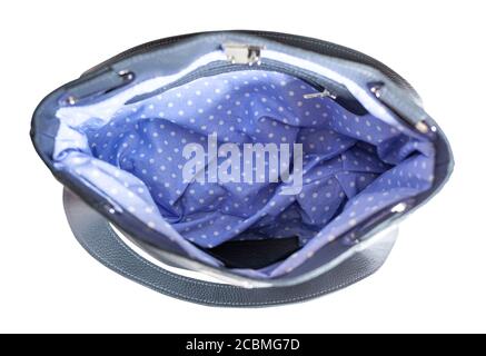 top view of empty handcrafted soft leather handbag with blue dotted lining isolated on white background Stock Photo