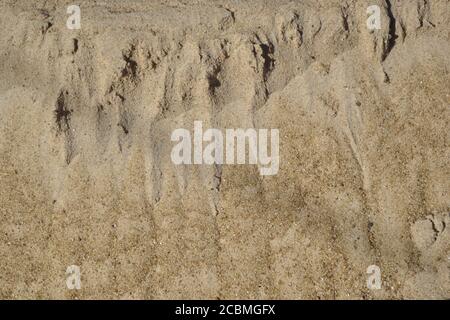 Sand from a building photographed for background purposes, sand used in the construction of houses and walls Stock Photo