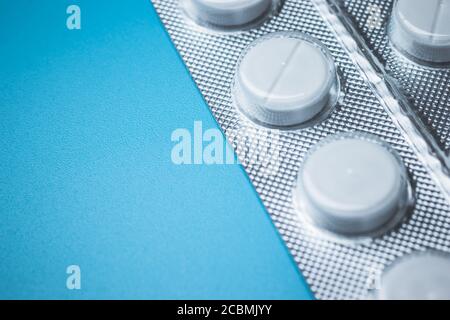 Simple white pills on background with copy space Stock Photo