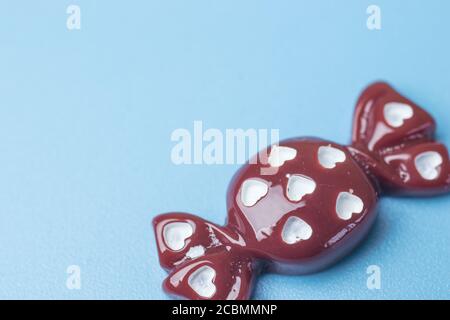 Toy candy on blue background with copy space Stock Photo