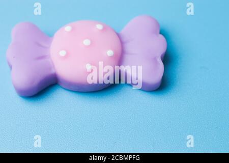 Sweet candy toy on blue background top view Stock Photo