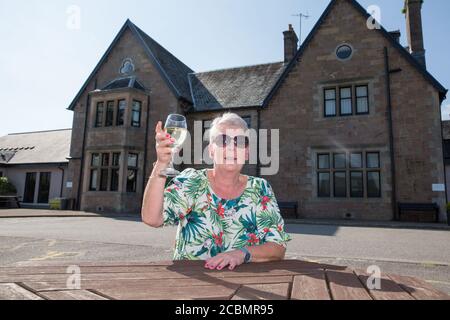 Caroline Hedley, 57, an auxiliary nurse at Hawick Community Hospital, enjoys the view at the Loch Fyne Hotel and Spa in Inveraray, Argyll and Bute, where she and other key workers received a 'sanctuary weekend'. Stock Photo