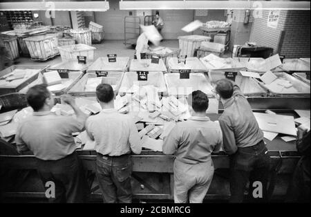 Workers sorting mail at Post Office, New York City, New York, USA, Thomas J. O'Halloran, U.S. News & World Report Magazine Photograph Collection, May 1957 Stock Photo