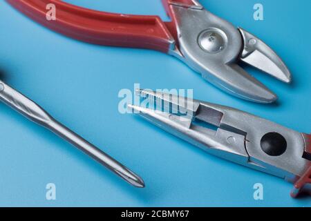 Home repair tools flat lay on blue background above view Stock Photo