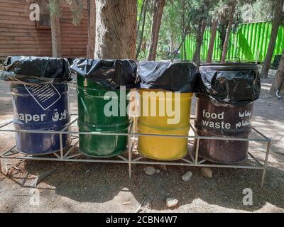 several bins with different color using to collect rubbish in Jordan Park Stock Photo