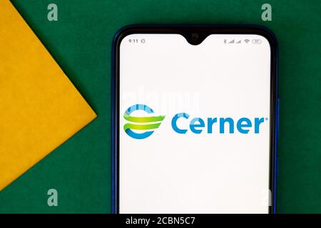 In this photo illustration the Cerner Corporation logo seen displayed on a smartphone. Stock Photo