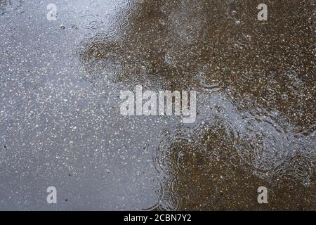 texture of asphalt chips, water and raindrops Stock Photo