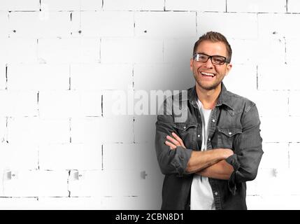 Young man in denim shirt is smiling Stock Photo