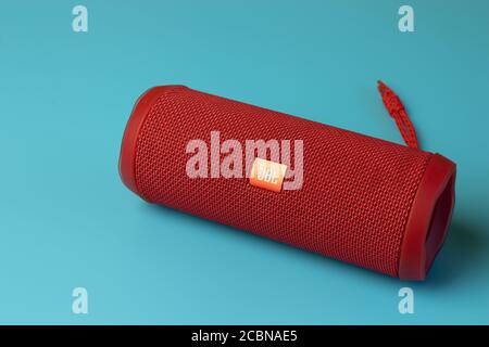 Moscow, Russia - 1 June 2020: JBL Flip 4 GO on blue background , Illustrative Editorial Stock Photo