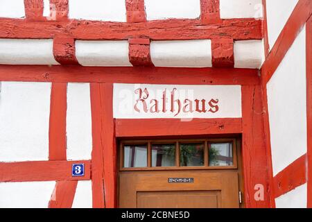 Entrance of the town hall, in the four-gabled house, Monreal, idyllic half-timbered village in the valley of the river Elz, in the district of Mayen-K Stock Photo