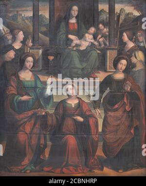 FERRARA, ITALY - JANUARY 30, 2020: The  painting of Madonna with the sains martyrs in church Chiesa di Santa Maria in Vado by Michele Coltellini Stock Photo