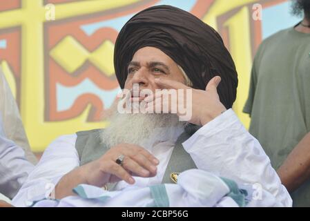 Lahore, Pakistan. 14th Aug 2020. Khadim Hussain Rizvi leader of a religious group Tehreek-e-Labaik Pakistan (TLP) a hard line religious political party, addressing to supporters during a rally to mark Pakistan's Independence Day in Lahore. As the nation celebrate the 73rd Independence Day of Pakistan in befitting manners, Besides, vehicles could be seen on roads painted with national flag colors, which shows the enthusiasm of the people to commemorate the country's Independence Day.The annual celebration is every 14th day of August. Credit: Pacific Press Media Production Corp./Alamy Live News Stock Photo