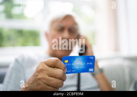 Elder Scam Call And Senior Pension Finance Fraud Stock Photo