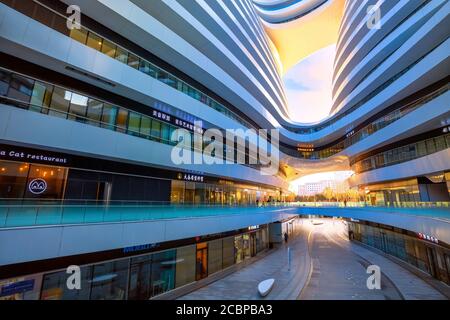 Beijing, China - Jan 12 2020: Galaxy Soho Building is an urban complex opened in 2014, designed by  architect Zaha Hadid. The complex offers shops, of Stock Photo