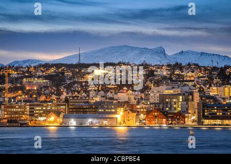 View over the harbour and city at dusk, polar night, winter, Tromsoe, Troms, Norway Stock Photo