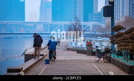 Tianjin, China - Jan 16 2020: Cityscape of Tianjin city with buiding and architecture on the side of Haihe river bank Stock Photo