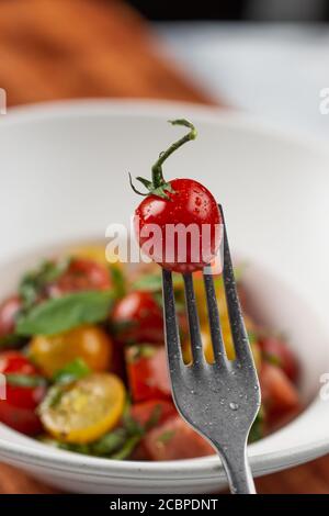 Cherry on fork Stock Photo