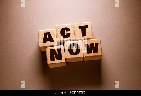 Act now Word Written on Wooden Cubes Stock Photo