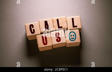 Call Us Word Written on Wooden Cubes Stock Photo