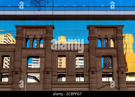 Classical style facade architecture mixed with modern glass in Santiago de Chile at sunrise, Chile. Stock Photo