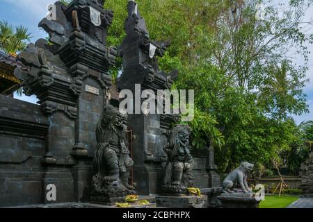 Statues at the entrance of a hinduist temple in Bali, Indonesia Stock ...