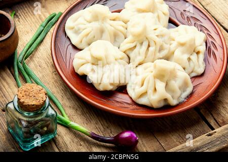 Georgian dumplings khinkali with meat on wooden table Stock Photo