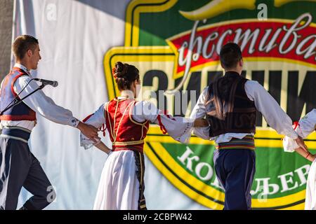 Koceljeva / Serbia - October 1, 2016: Young men and girls dancing Serbian traditional national folk dance Kolo Stock Photo