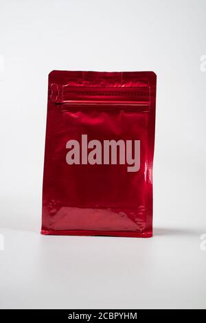 red blank standing pouch mockup over white background Stock Photo