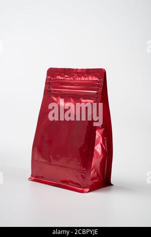 red blank standing pouch mockup over white background Stock Photo