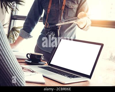 Startup business teamwork concept. Group of young Asian coworkers business people using laptop discussing about business creative project. Stock Photo