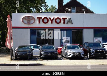 Toyota company logo seen on one of their car dealerships showrooms. Stock Photo