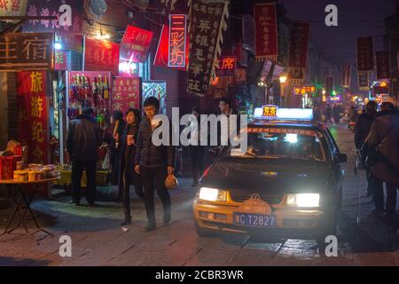 Luoyang, Henan Province / China - January 3, 2016: Lively Luoyang Old Town district at night, with traditional shops and restaurants Stock Photo