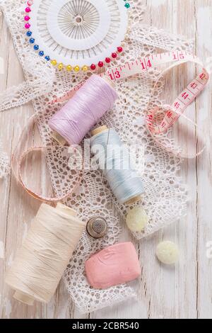 Assortment of sewing accessories on white background. Concept of handcraft. Stock Photo